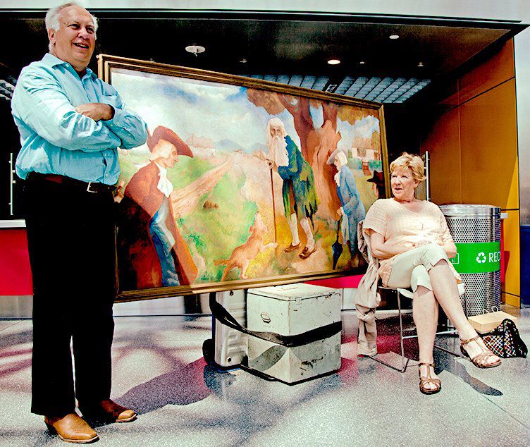 Former Assemblyman Richard Brodsky with his items—a WPA oil cartoon of Rip Van Winkle and a 2000 hanging chad machine from the 2000 election.<br/>